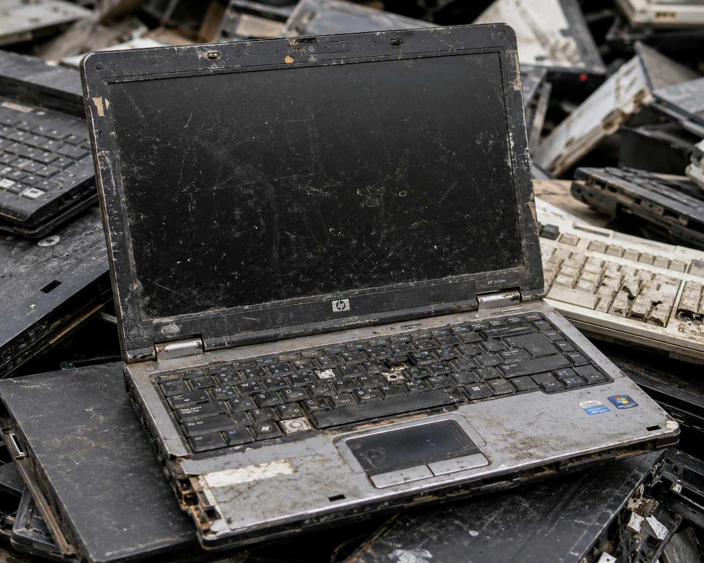 Person handing over an old laptop for e-waste donation in Zirakpur